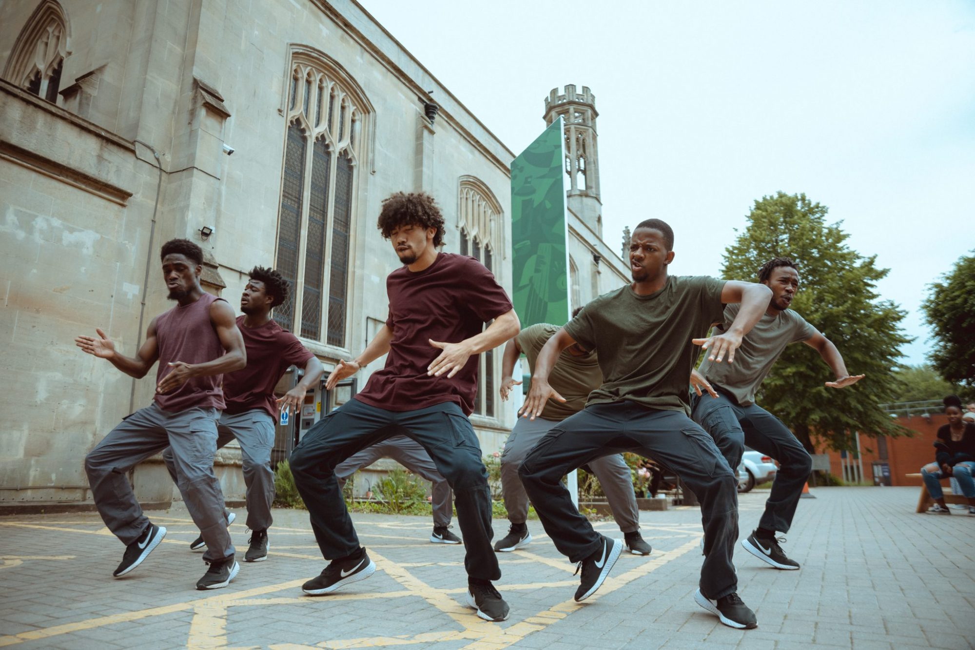 a group dances outside the Trinity Building in Bristol, as part of Born to Protest - a hip-hop dance theatre show by choreographer Joseph Toonga