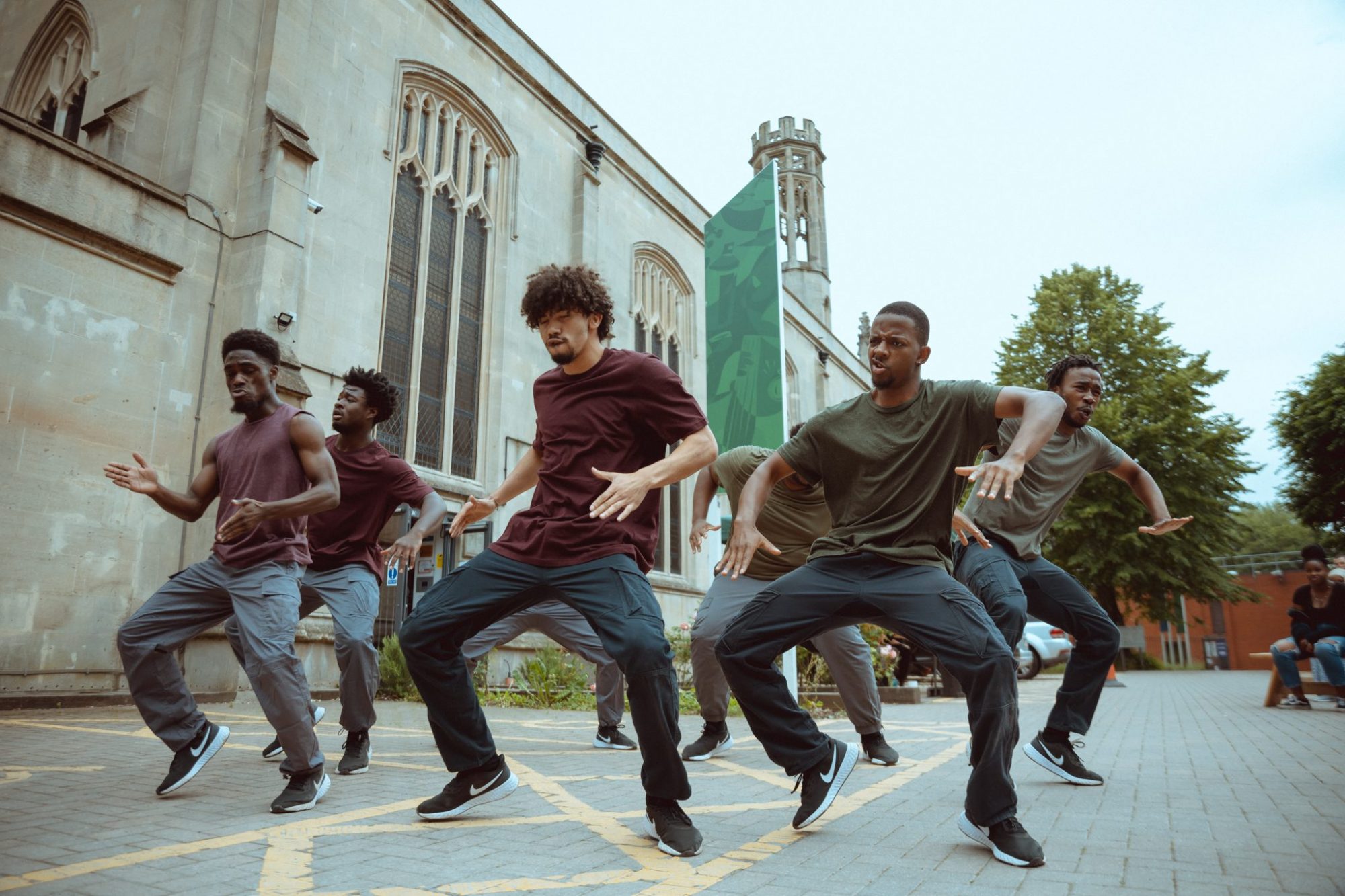 Trinity_Community_Arts_Born_to_Protest_Trinity_Presents_Photo_credit_Khali_Ackford a group dances outside the Trinity Building in Bristol, as part of Born to Protest - a hip-hop dance theatre show by choreographer Joseph Toonga